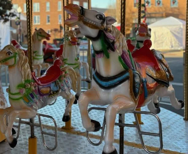Carousel carnival ride rental with painted horses and classic midway style