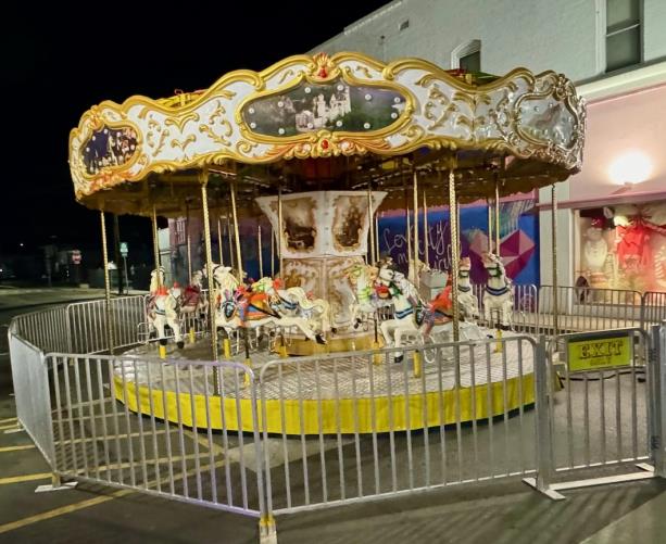 Carousel rental with bright horses for school carnivals and town fairs
