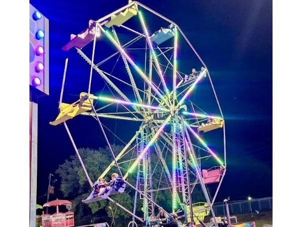 Ferris wheel carnival ride with colorful seats for families
