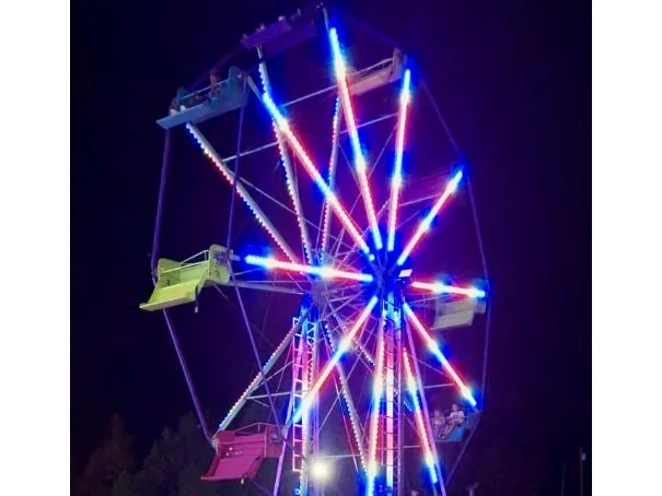 Ferris wheel ride rental lit for a memorable festival backdrop