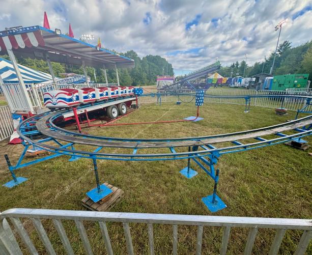 Children’s roller coaster ride rental with bright carnival track