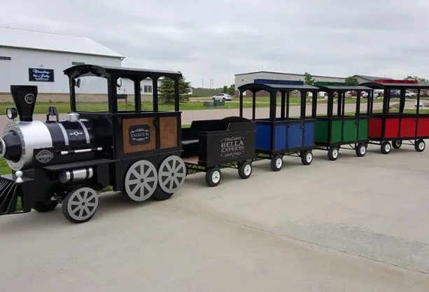 Trackless train carnival ride with family passenger cars