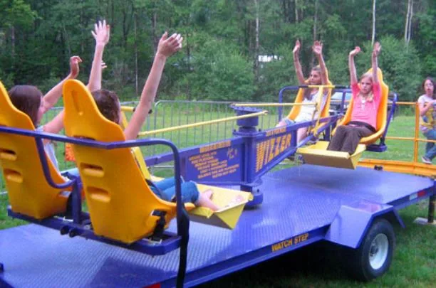 Wizzer kiddie carnival ride rental with colorful spinning seats